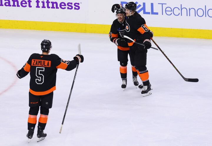 Philadelphia Flyers' Egor Zamula, Travis Konecny, and Travis Sanheim (Heather Cattai/Heather Barry Images, LLC)